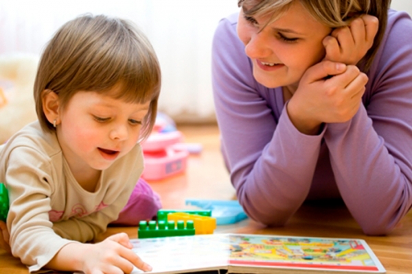 Mother and child having fun while teaching and playing together